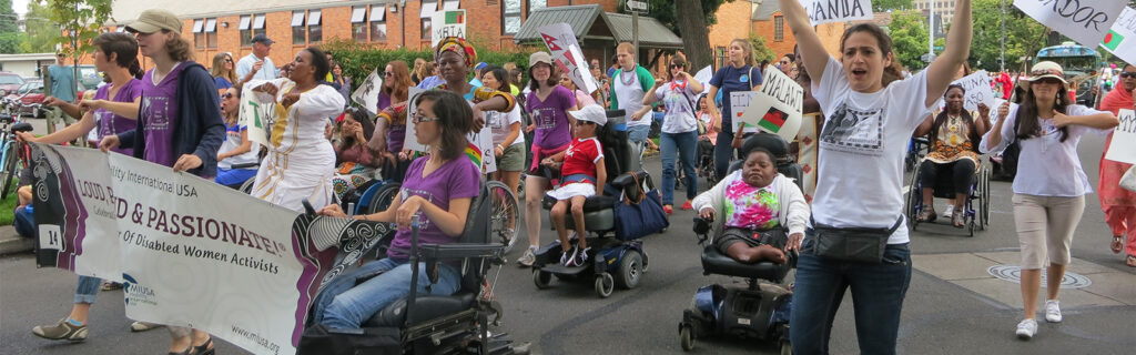 women with disabilities marching in a parade