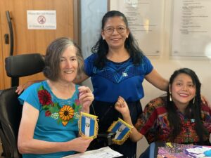 A WILD delegate and Personal Assistant from Guatemala wave their country's flag with their host family.