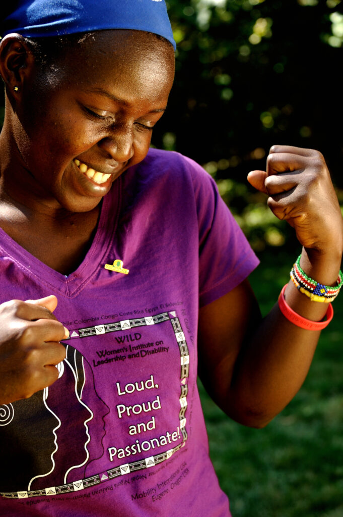 Caroline South Sudan wearing purple WILD tshirt.