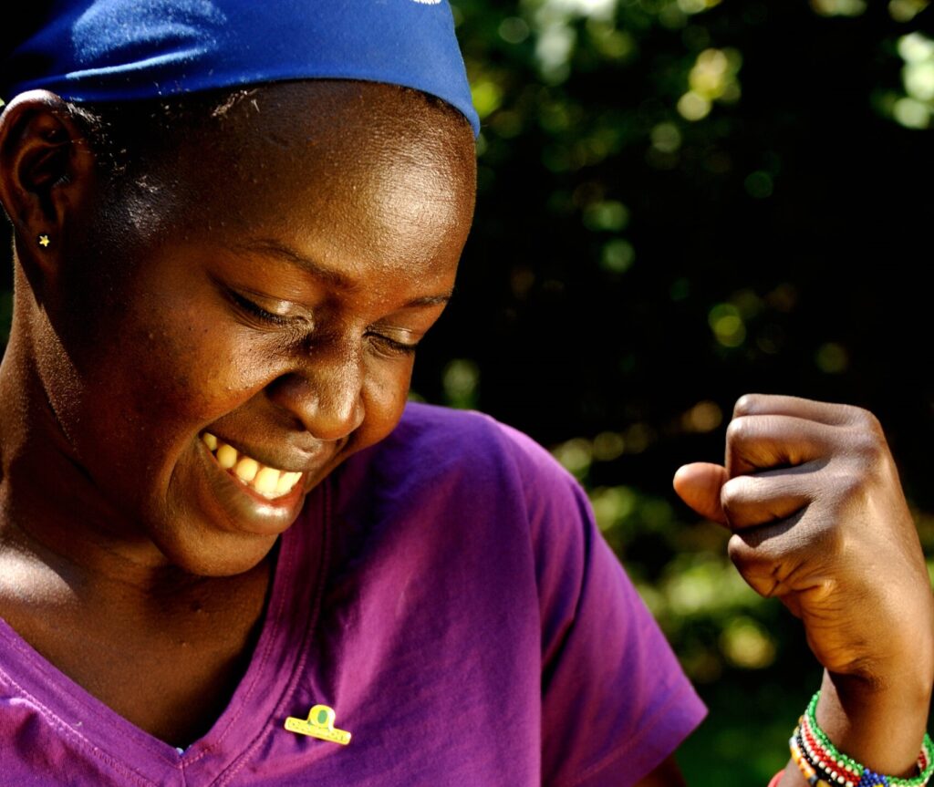 Caroline South Sudan wearing purple WILD tshirt.
