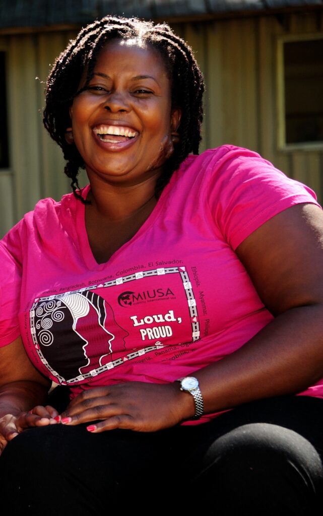 Scader wearing bright pink WILD LPP tshirt laughing