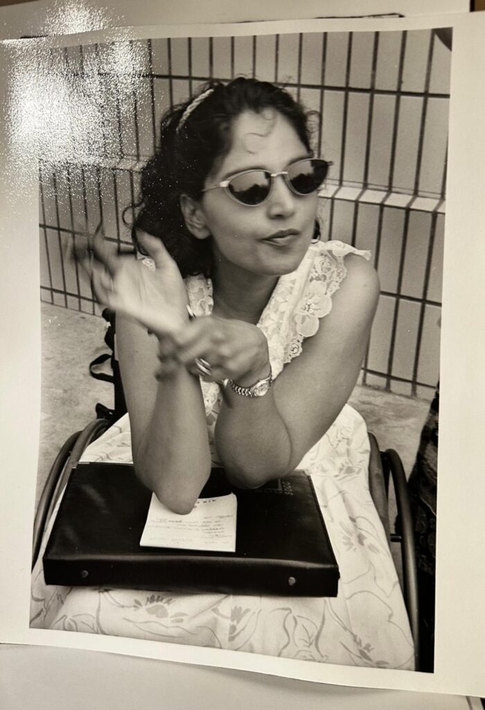 Black and white photo of a young Meenu at the 1995 Beijing Women's Conference.