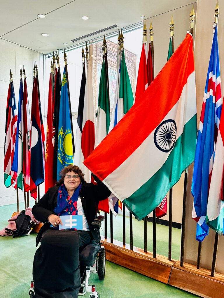 Meenu holds up the Indian flag.