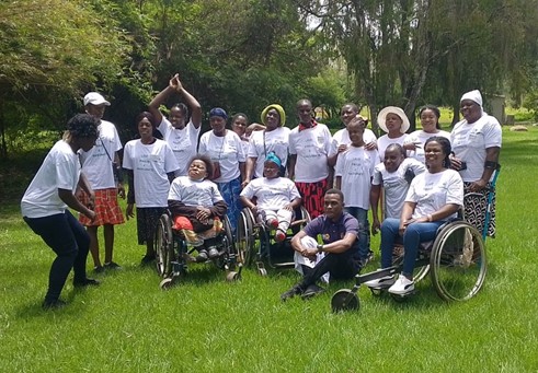 An outdoor group shot of WILD-Zimbabwe participants after completing their training.